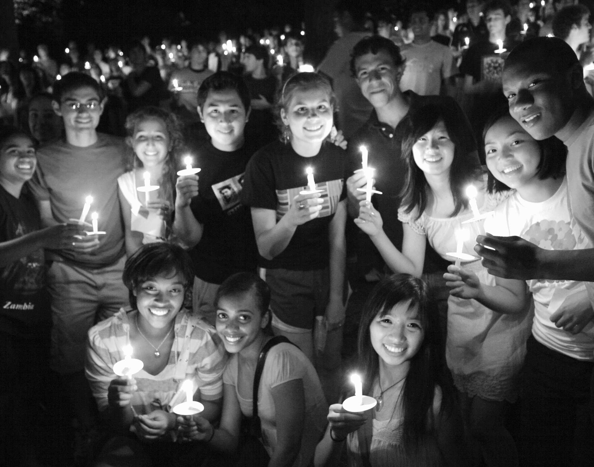 group of students holding candles