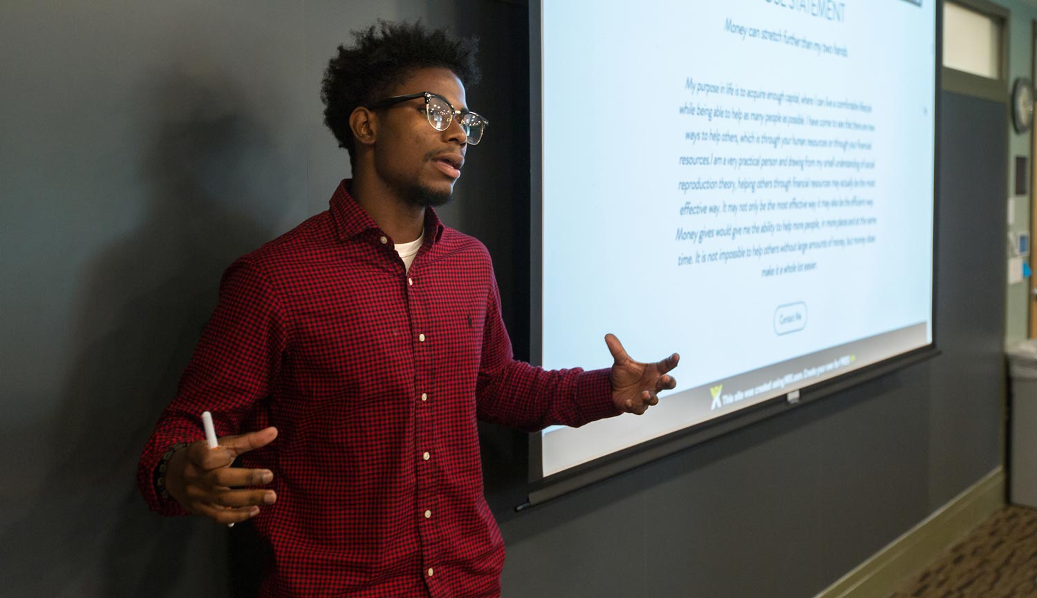 Black undergraduate student giving presentation