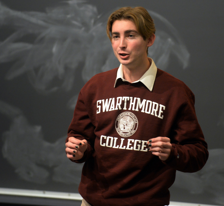 student with a Swarthmore College sweatshirt giving a presentation