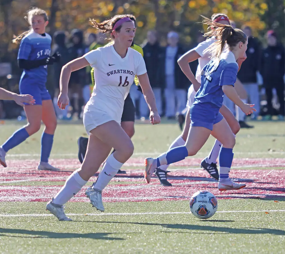 Swarthmore student soccer player running on field
