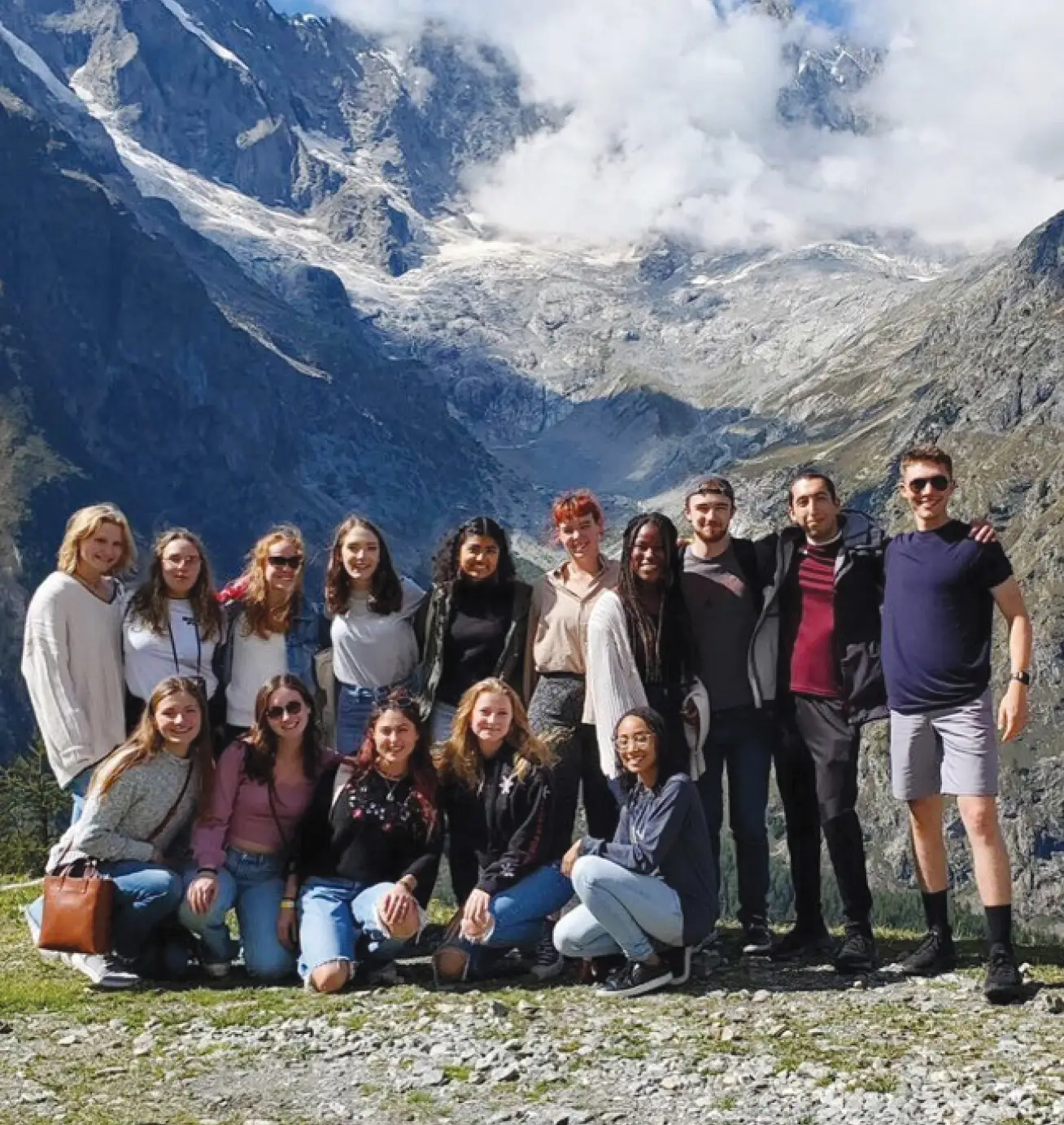 Group photo of students abroad atop a mountain