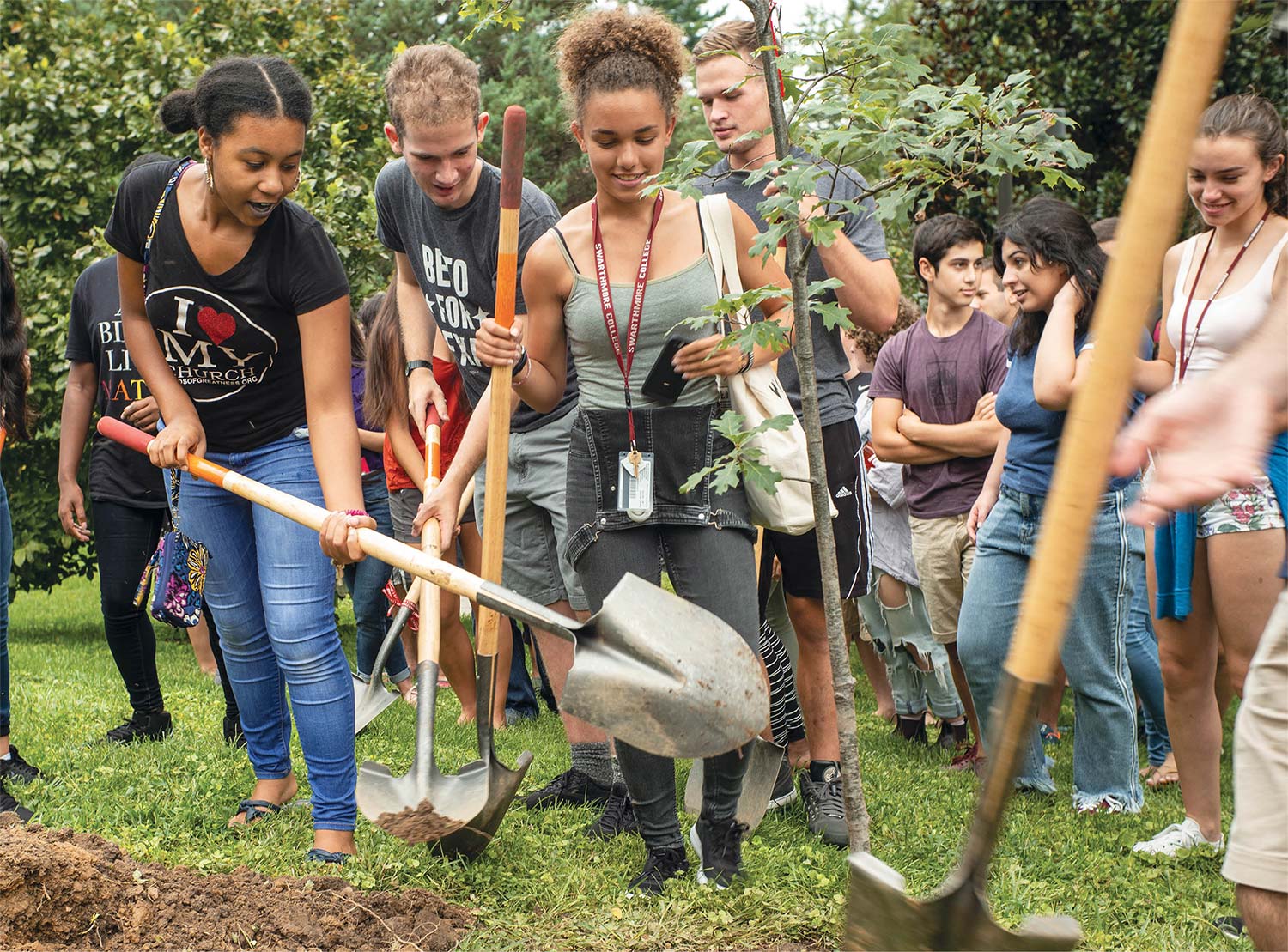 students planting and digging in a garden