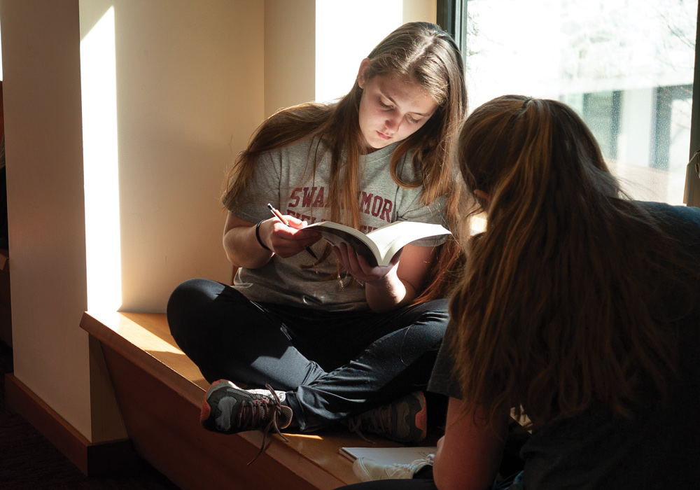 students studying by window