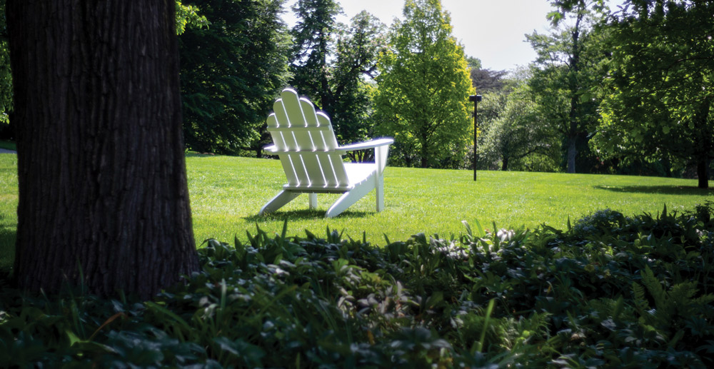 white wooden lawn chair outdoors