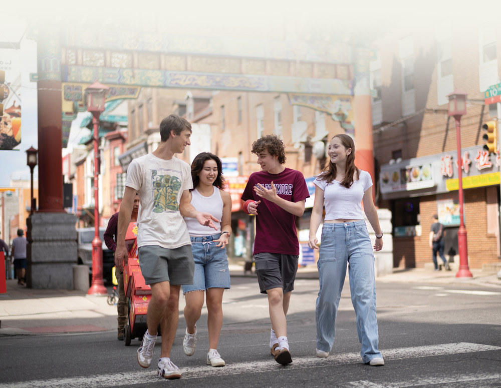 four students walking the streets of Philadelphia