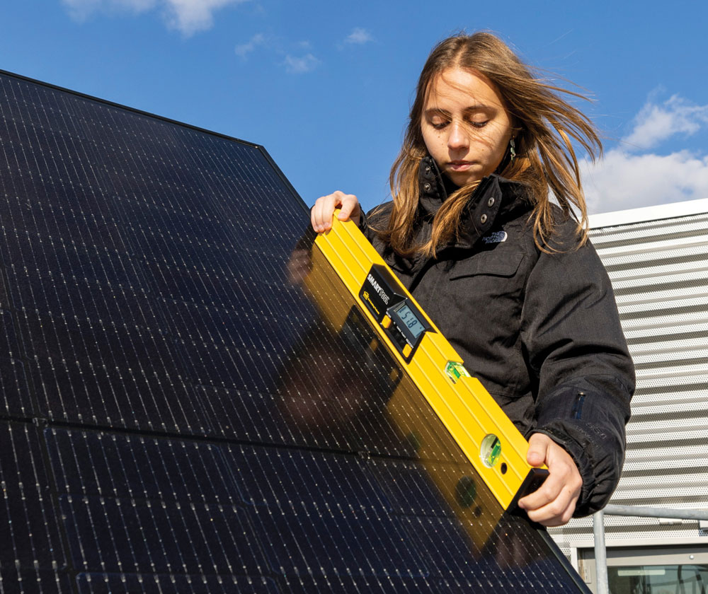 woman checked the balance of a solar panel