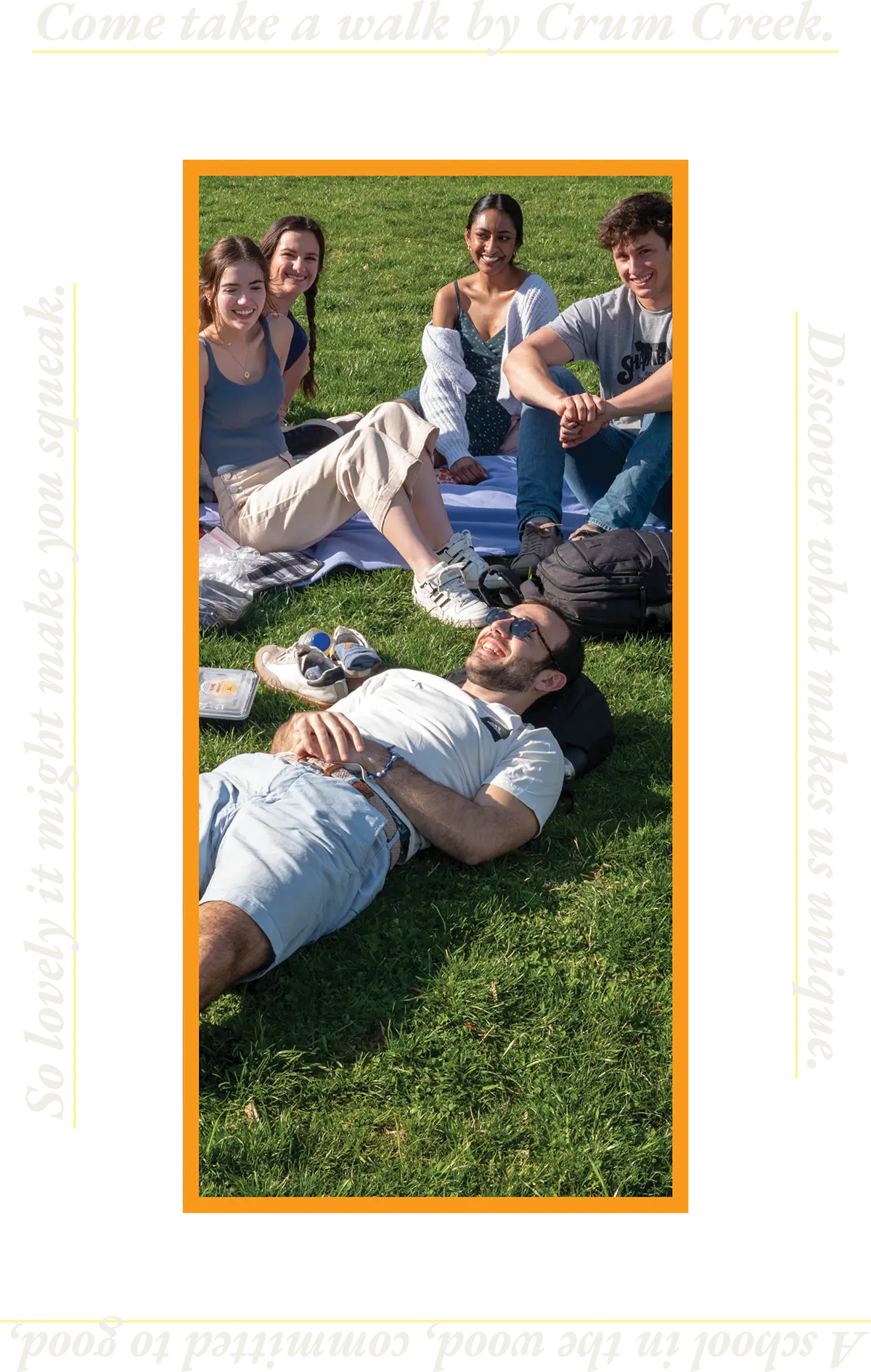 students sitting in the grass with their school bags with them